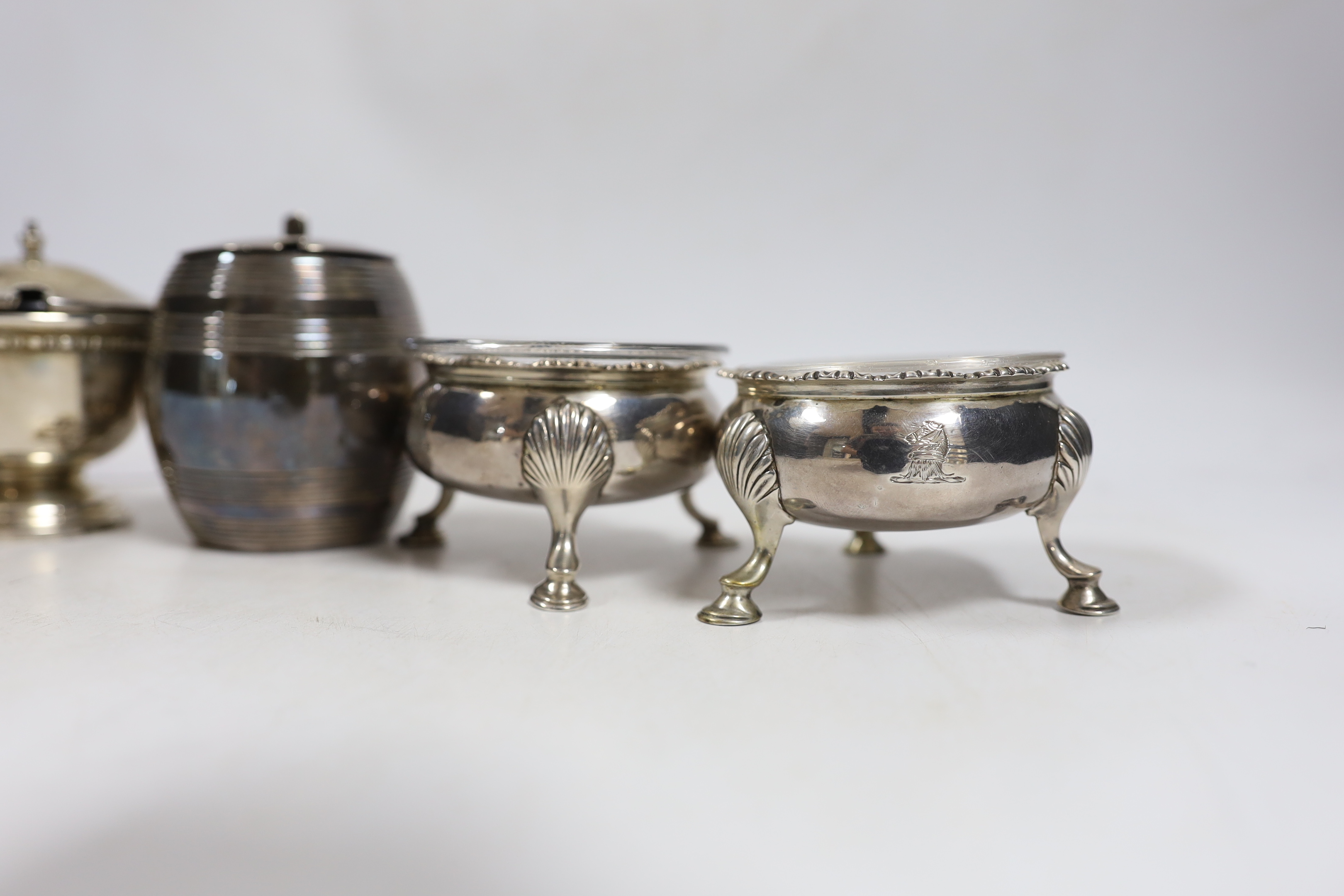 A pair of George III silver bun salts, London, 1767, together with four assorted George V silver mustard pots.